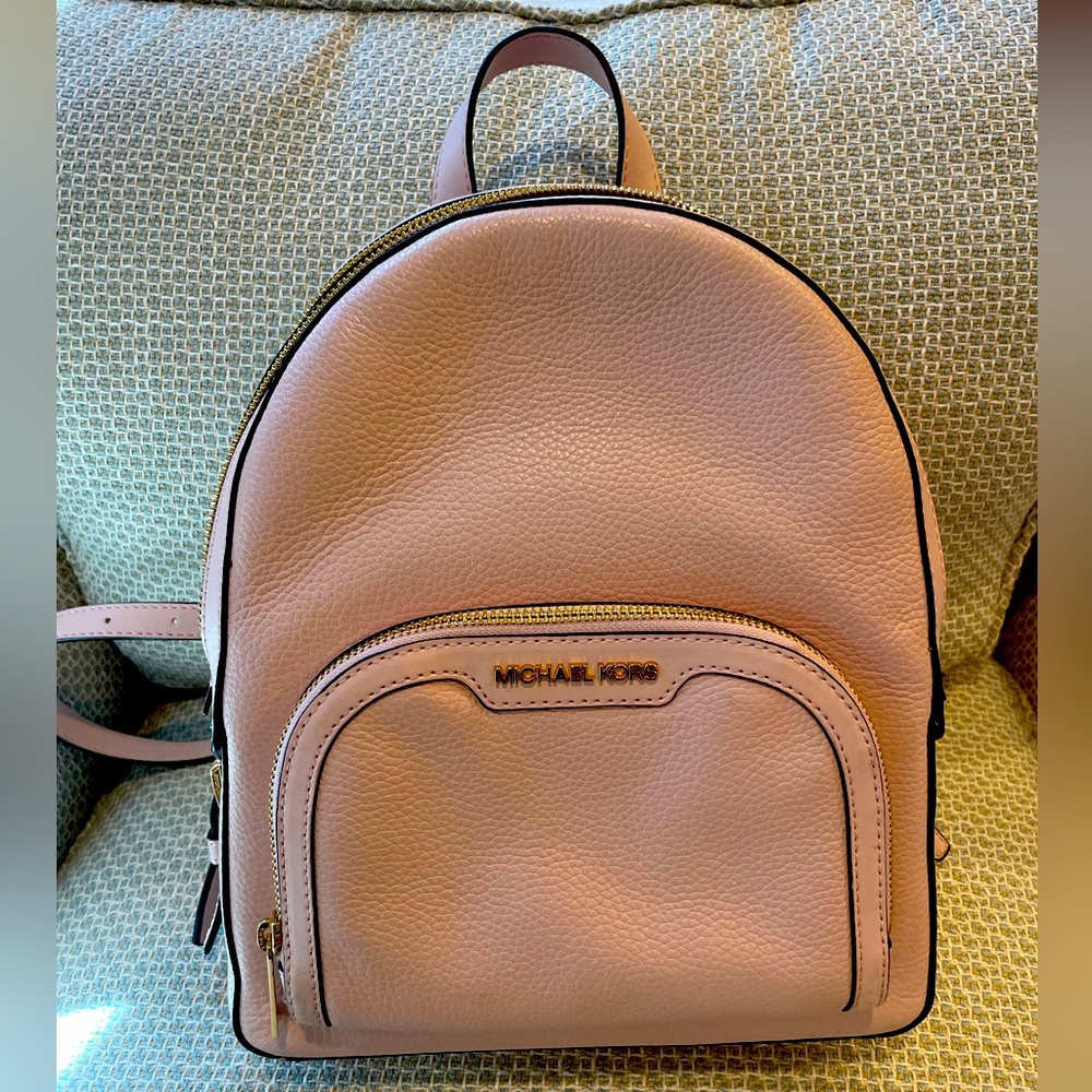 Light pink pebbled leather backpack.